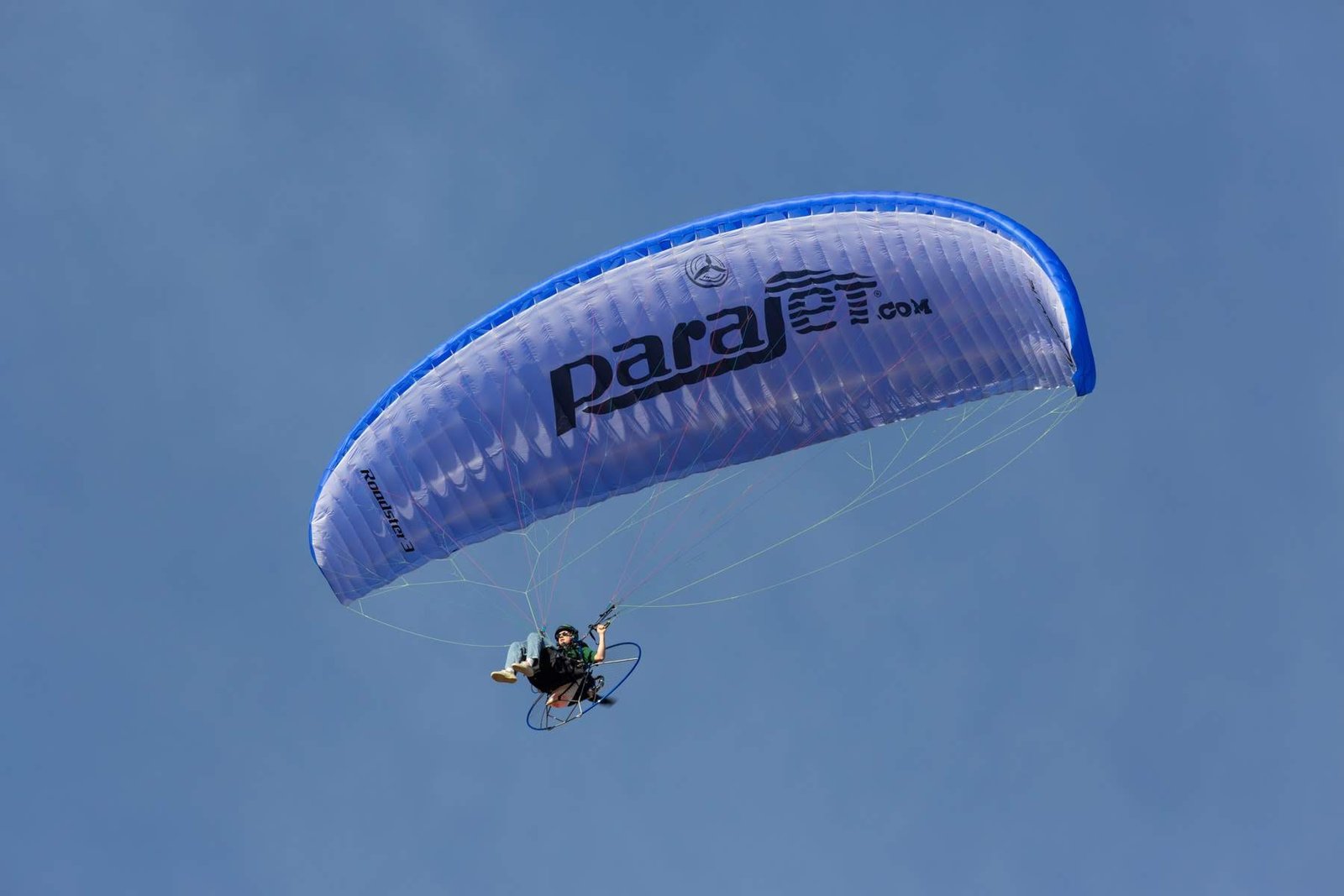 One of our paramotor students flying a parajet branded ozone roadster wing on a training course.