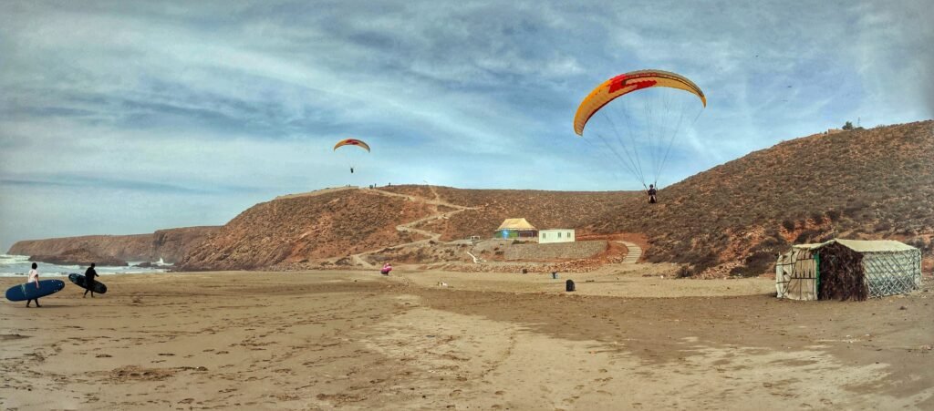 Seeing double - a paraglider comes in for a landing after a short flight in Morocco. this panoramic photo captures the pilot twice in one shot!