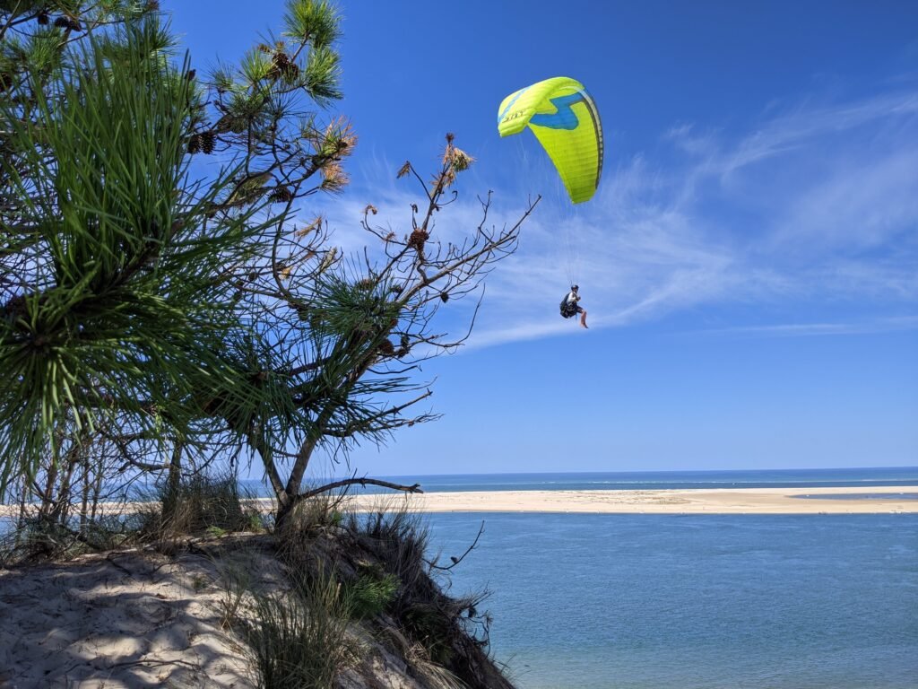 Soaring a paraglider at the Dune du Pyla with Sky Riders.