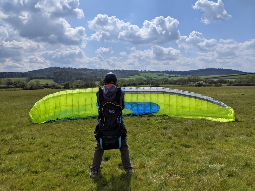 A student inflating a paraglider on a Sky Riders taster day